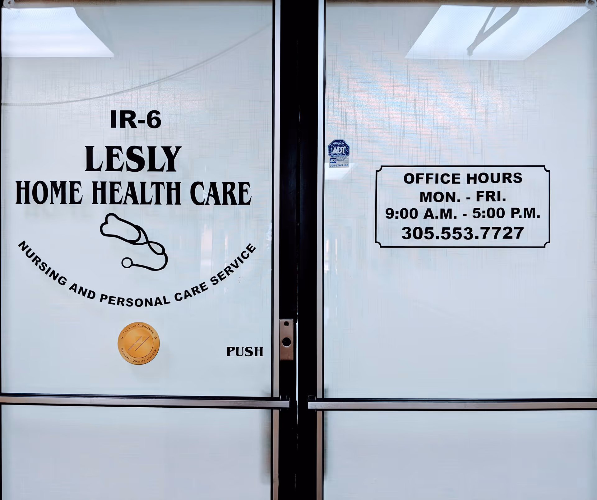 Glass doors show signage for Lesly Home Health Care, Inc. and office hours.