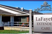 Exterior view of Lafayette Extended Care with sign and front porch.