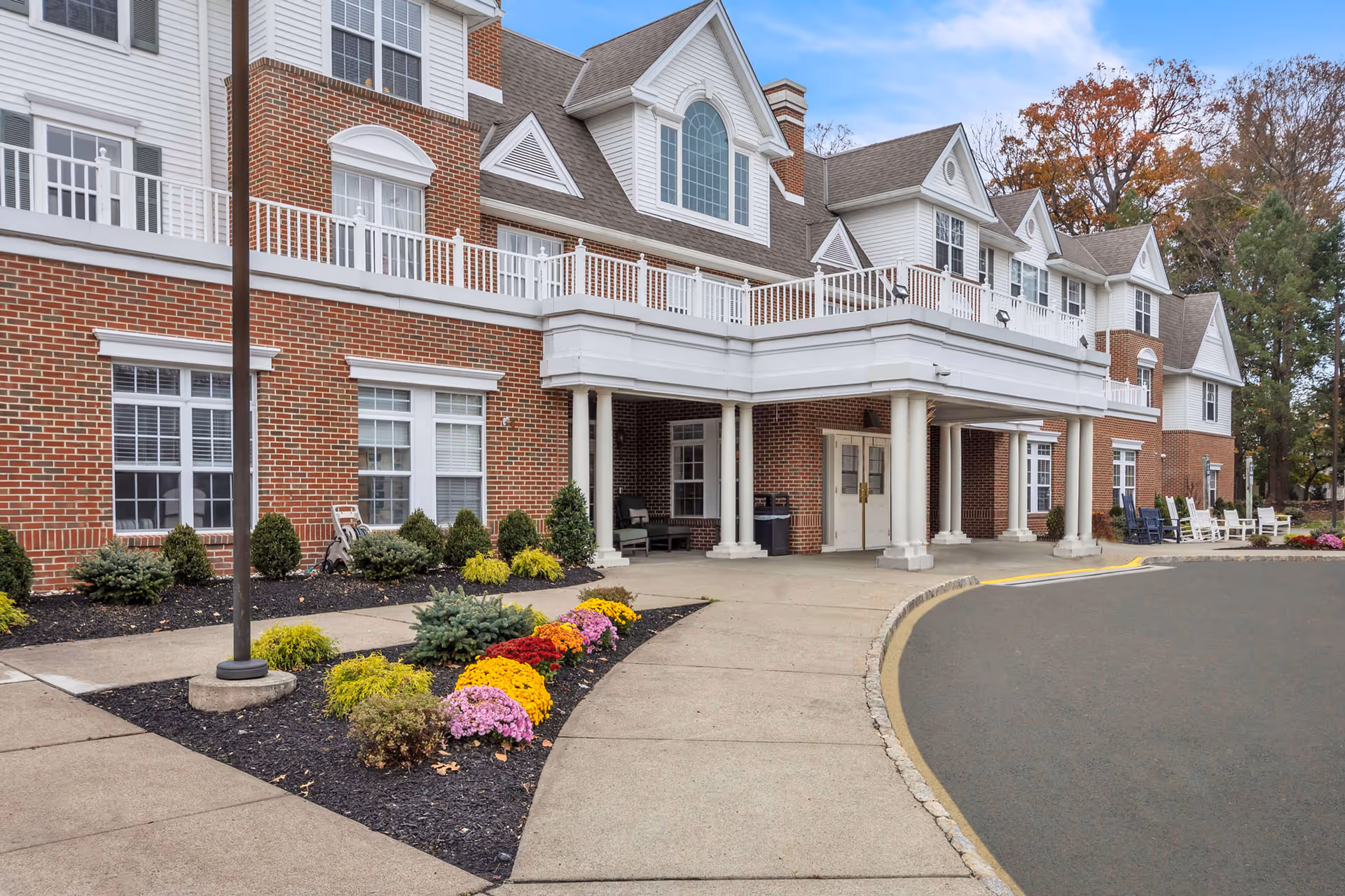 Exterior view of Brighton Gardens of Florham Park with brick facade and entrance canopy
