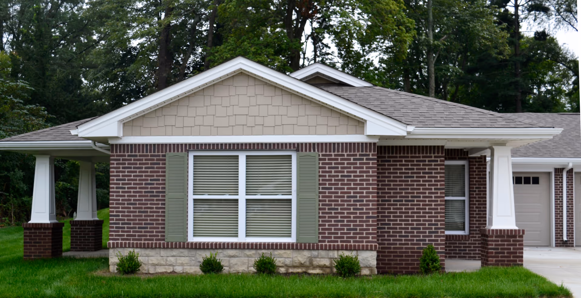 Westlake Health Campus exterior: brick facade, large front window, and green lawn.