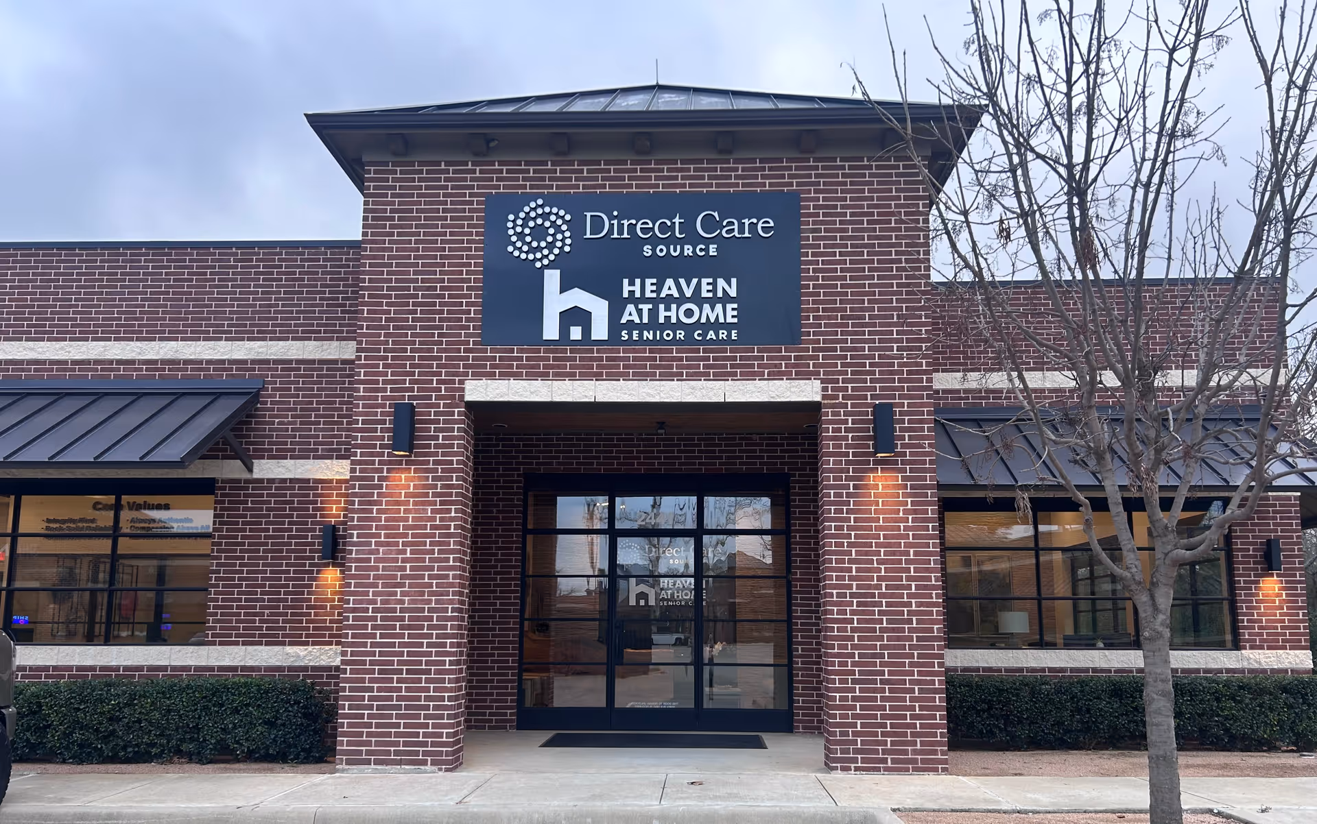 Brick storefront building with Heaven at Home Senior Care signage and glass entrance