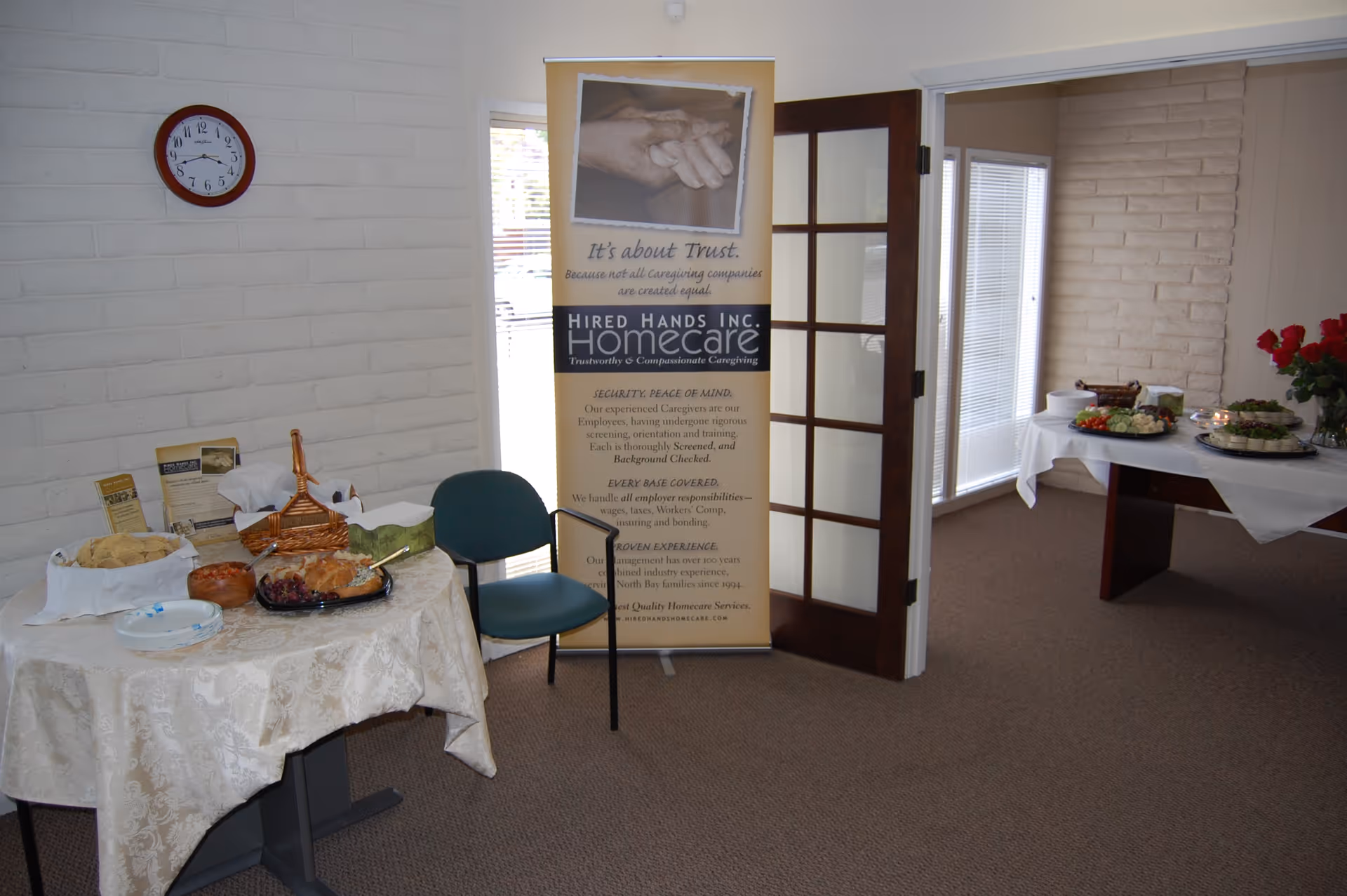 Interior dining area with buffet tables, food platters, and a promotional banner.