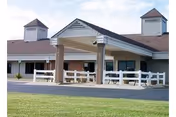 Front exterior of Fisher Senior Care and Rehab Center with a covered entrance.