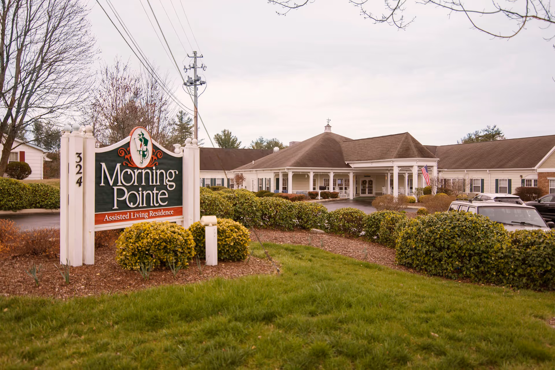 Exterior view of Morning Pointe of Greeneville assisted living facility with sign and entrance.