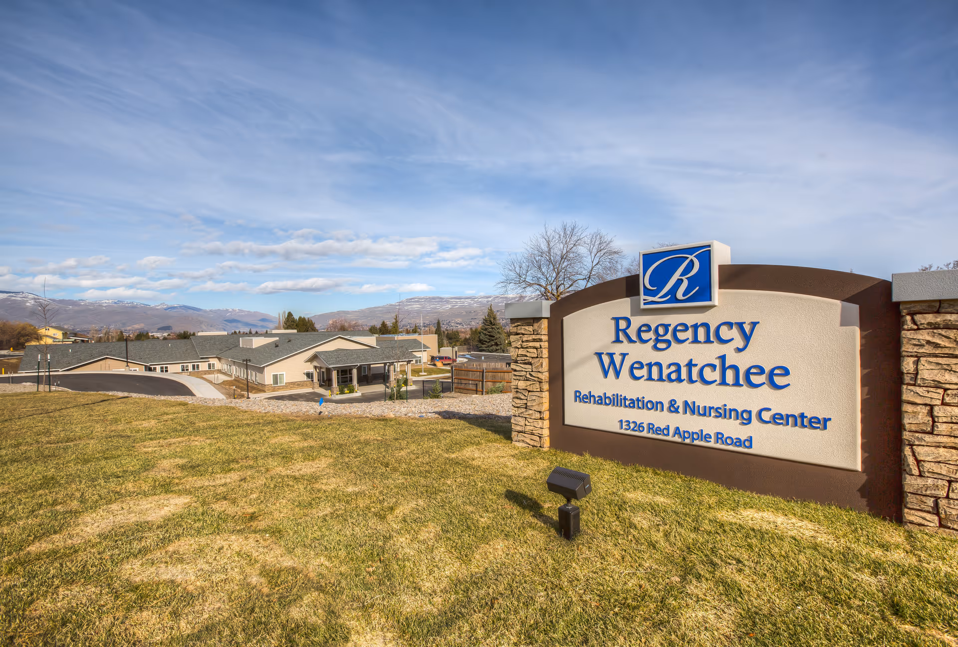 Exterior view of Regency Wenatchee Rehabilitation and Nursing Center sign and campus.