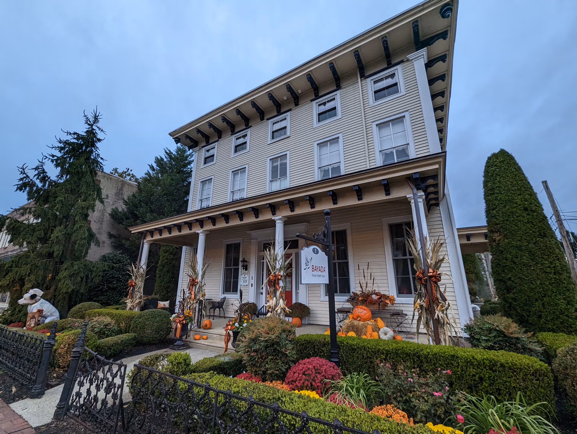 Front of Bayada Home Health Care building with pumpkins and fall decorations.