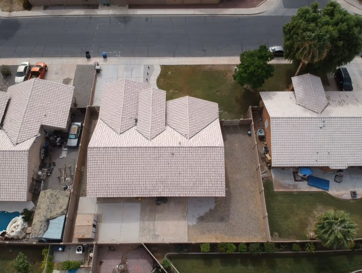Aerial view of Sunshine Caring Home exterior, showing connected beige tile-roofed houses.