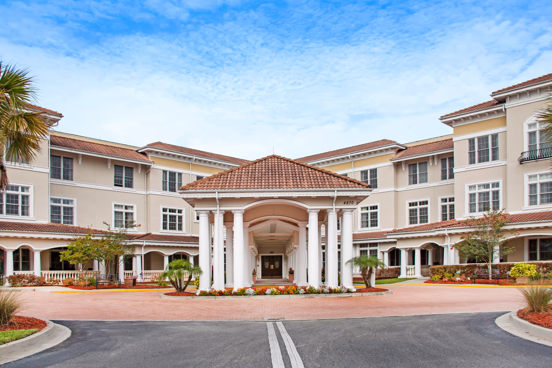 Sunrise of Jacksonville exterior with a central portico entrance and landscaped courtyard