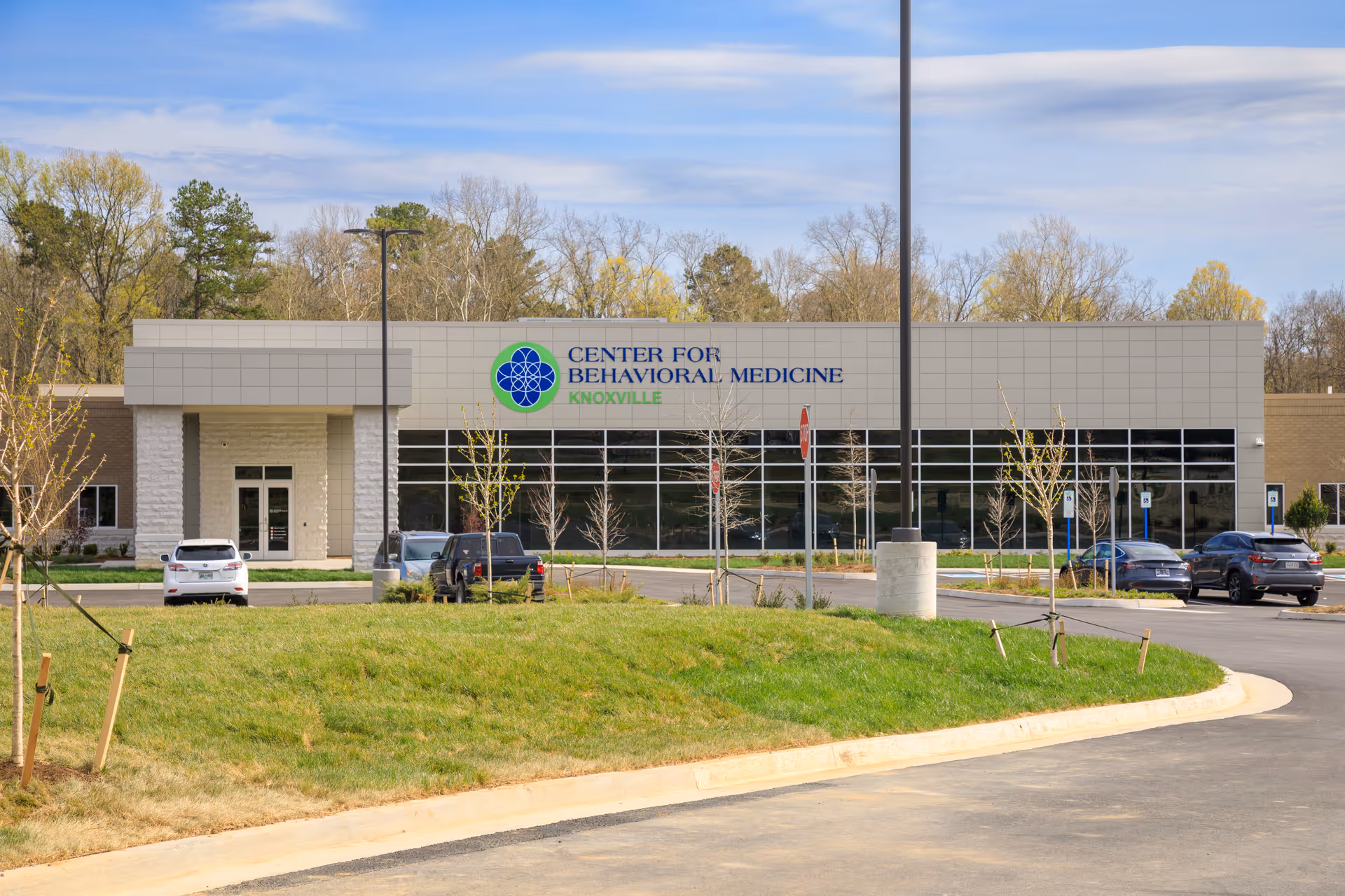 Exterior view of the Center for Behavioral Medicine in Knoxville with parked cars.