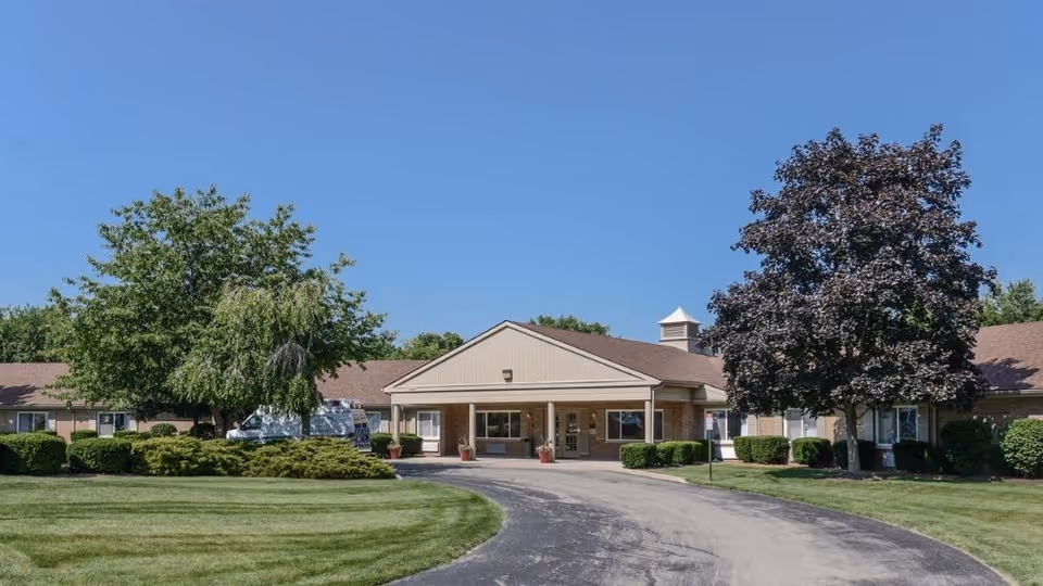 Front view of ProMedica Kettering facility with a curved driveway and landscaped entrance.