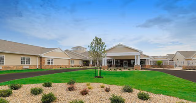 Exterior view of Westlake Health Campus entrance with manicured lawn and stone accents.