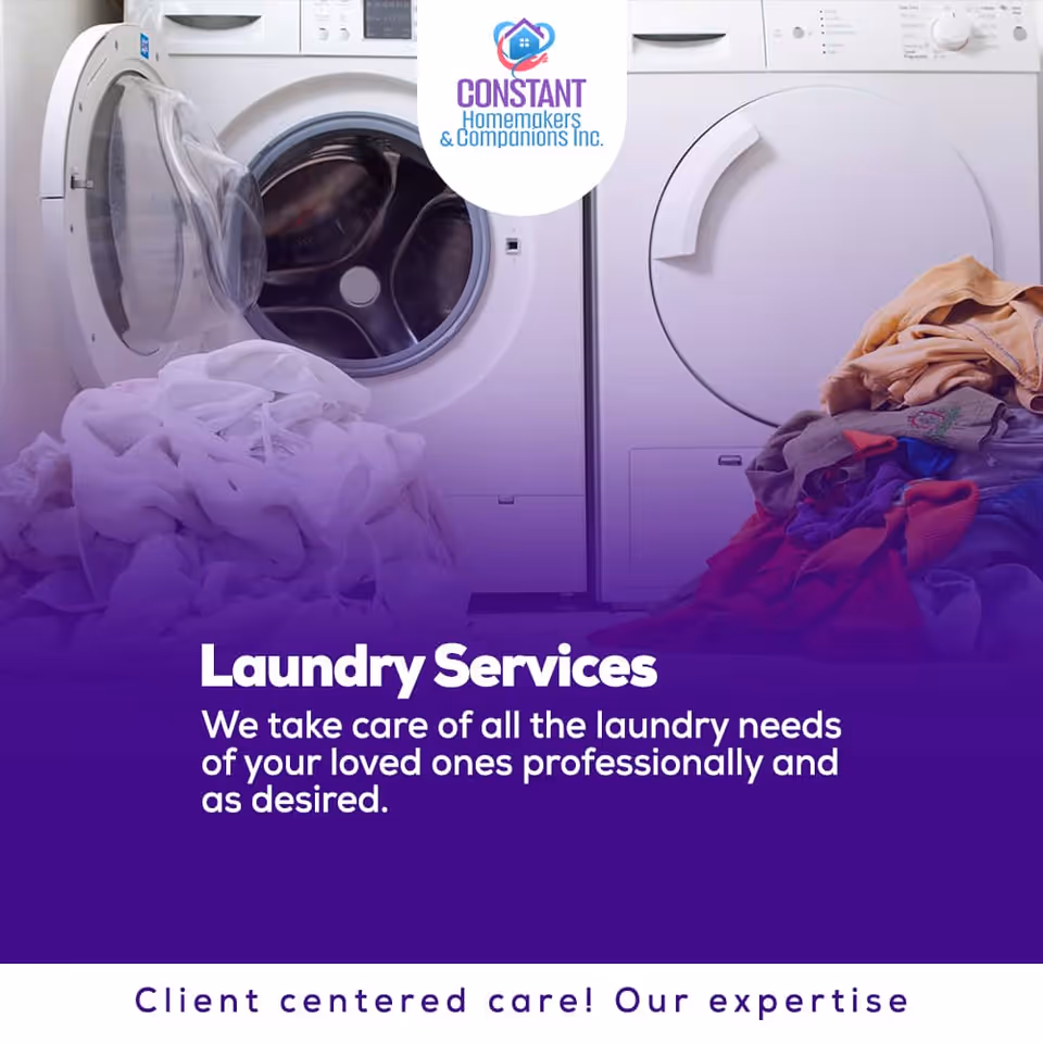 Laundry room featuring a front-loading washer, a dryer, and piled clothes.