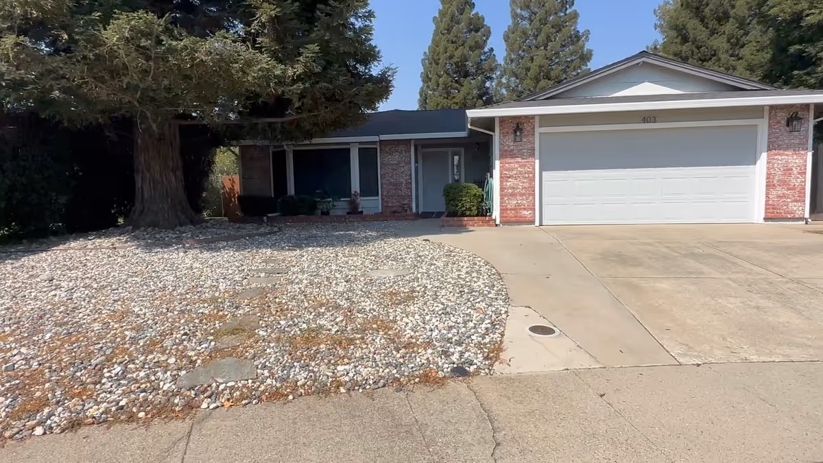 Front exterior of Diamond Oaks Home Care facility with brick facade and driveway.