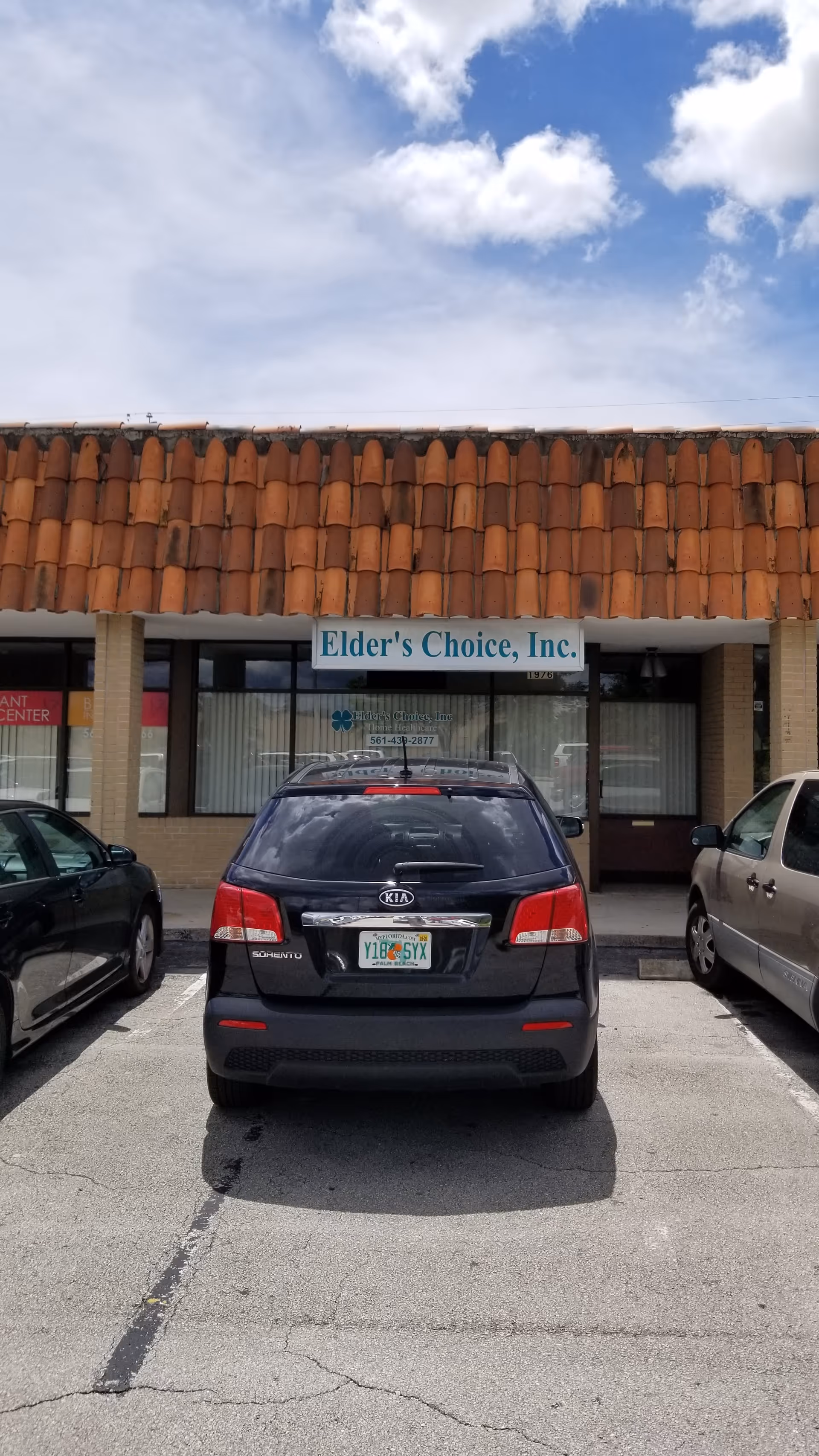 Storefront of Elder's Choice, Inc. with a car parked in front.