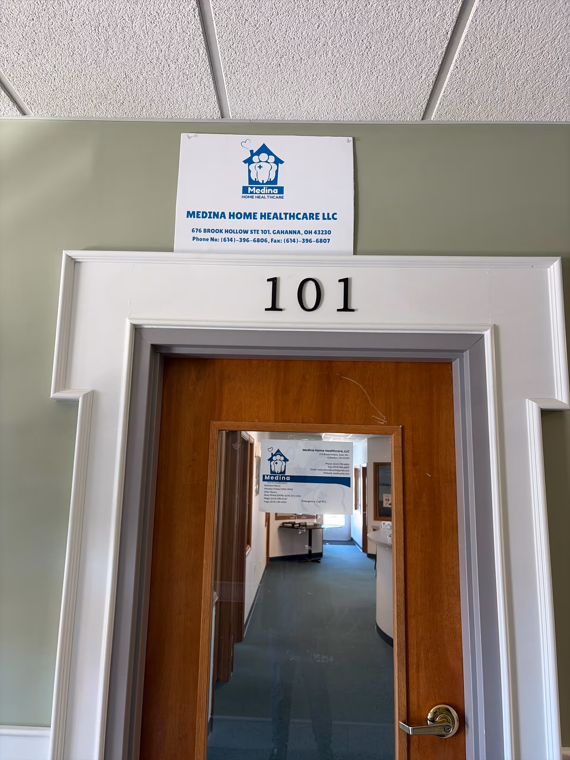 Interior hallway with a wood door labeled 101 and a Medina sign above.