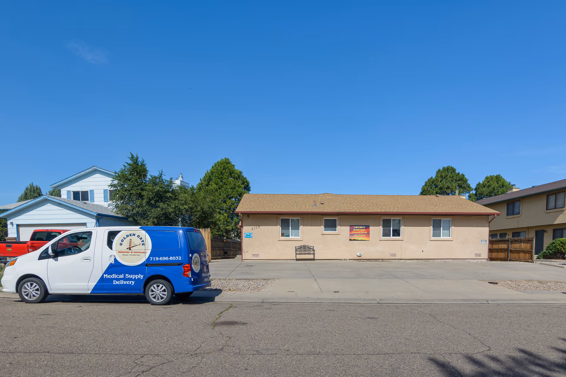 Front view of Golden Horizon senior living facility with a delivery van.