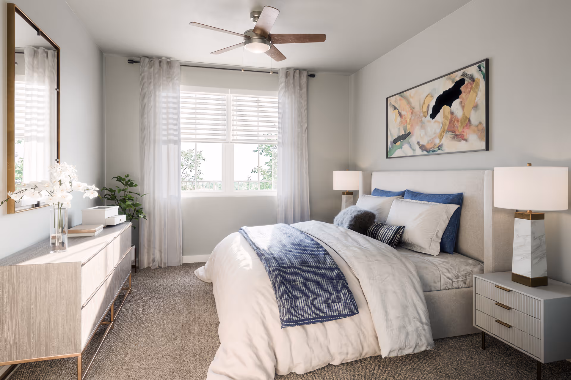 Bright bedroom featuring a bed, dresser, two nightstands, and a large window with curtains.
