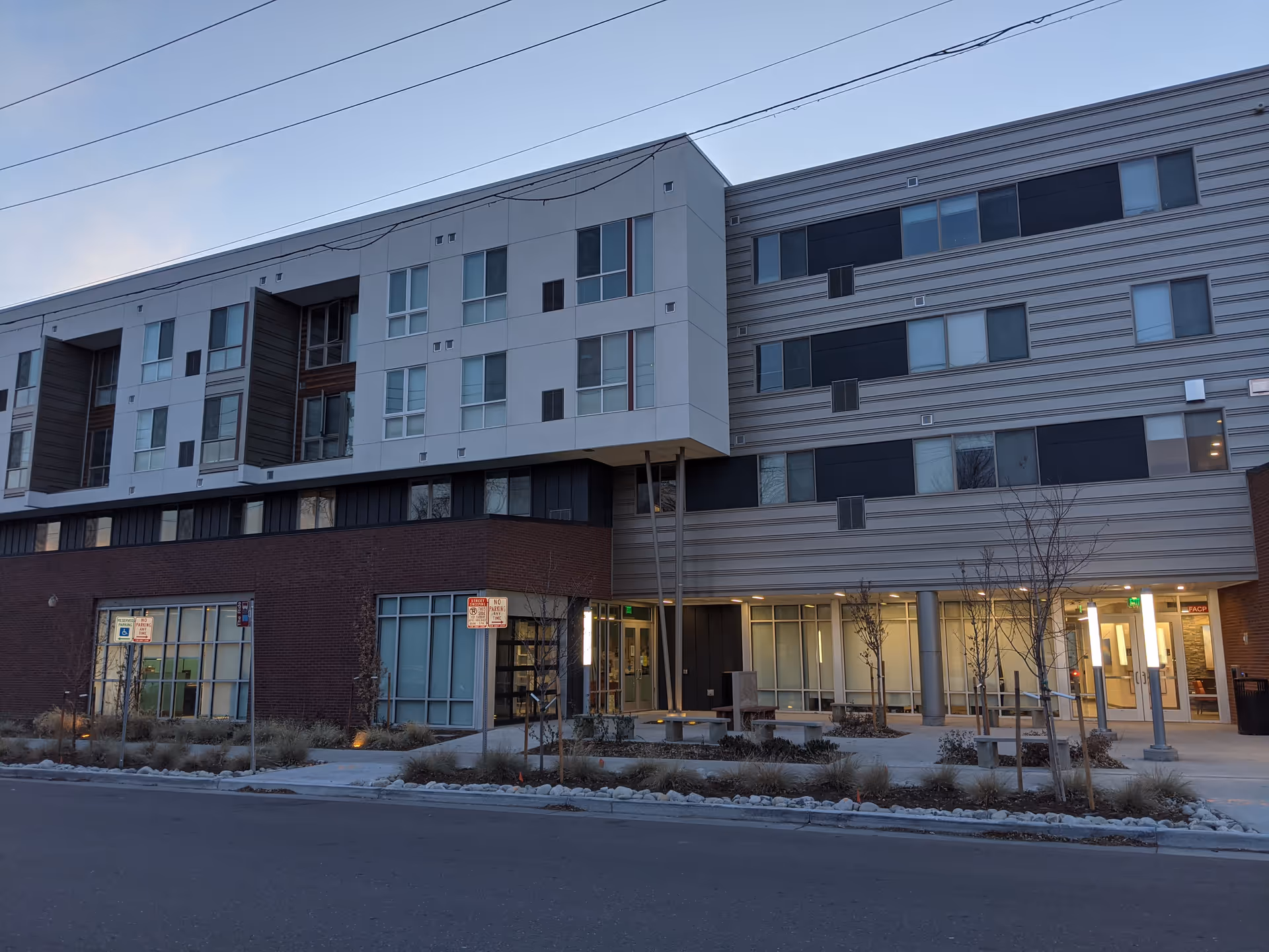 Exterior view of a modern, multi-story senior living building with an inviting entrance.