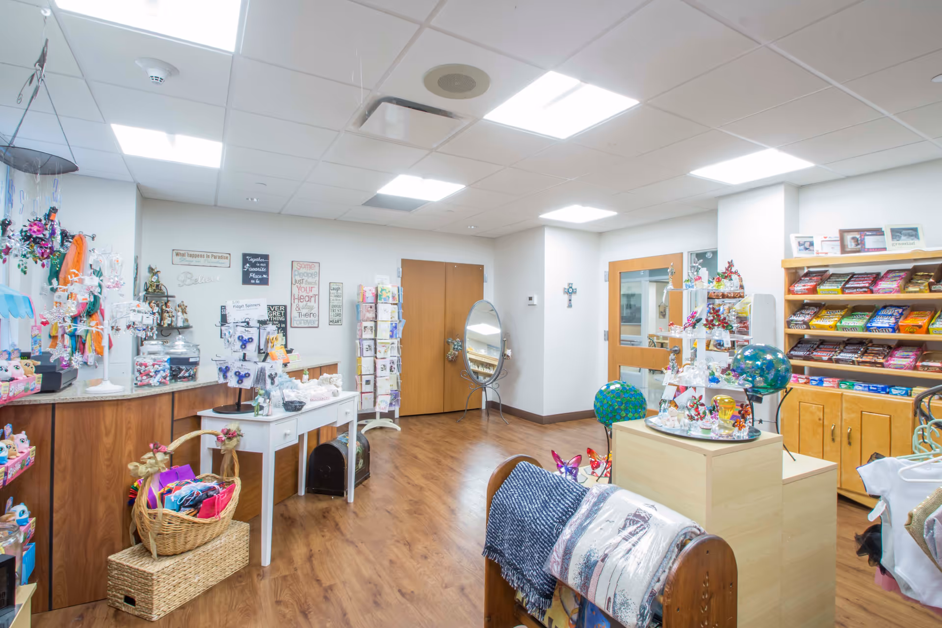 Indoor gift shop area in Carmel Richmond Healthcare and Rehab Center with shelves and displays.