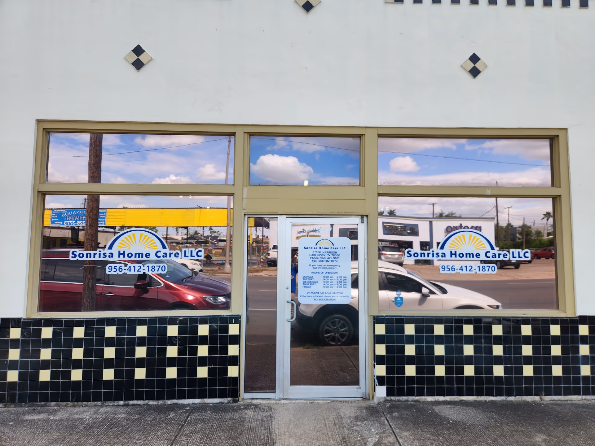 The storefront of Sonrisa Home Care LLC with glass windows and door