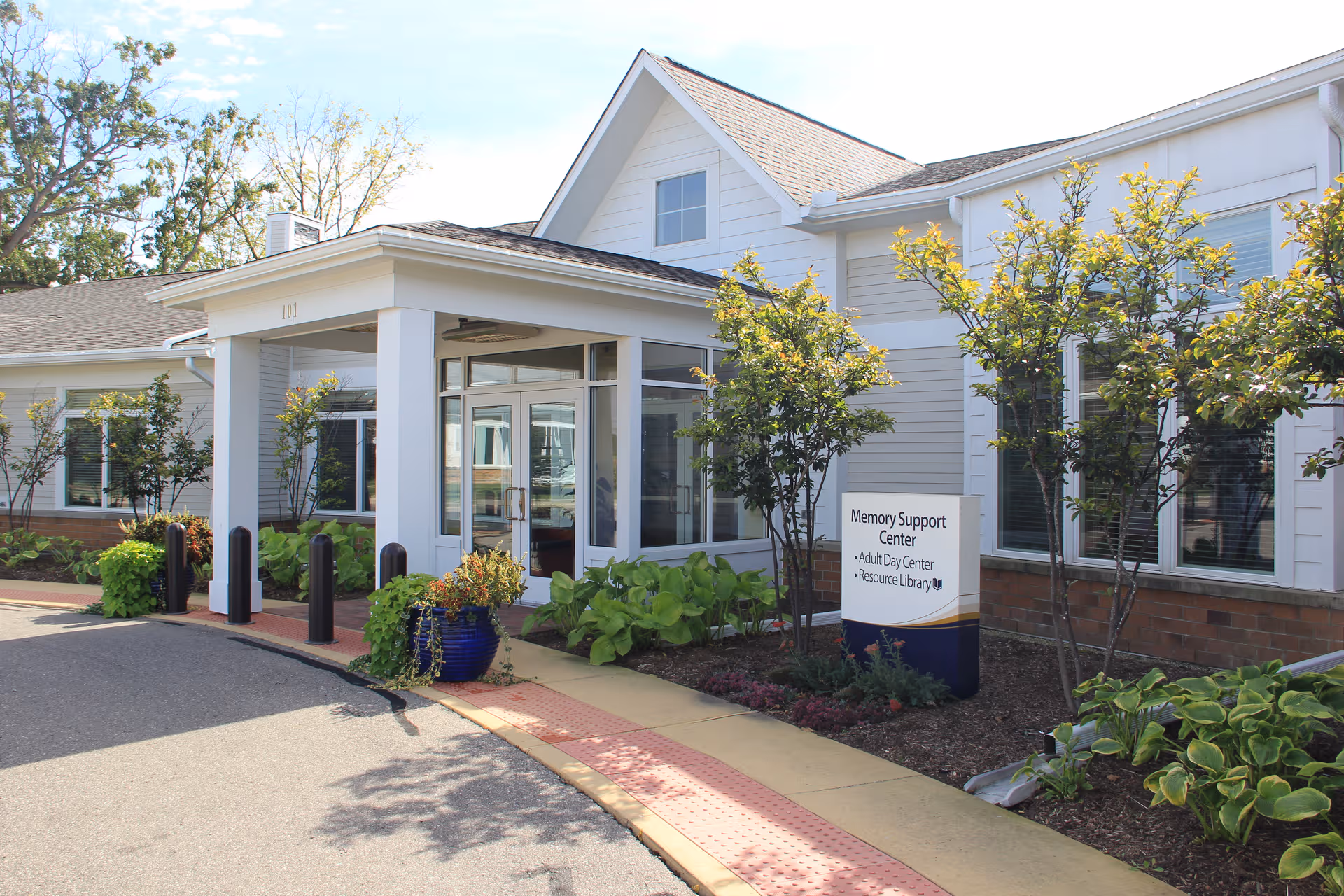 Exterior view of the Memory Support Center at Brecon Village entrance with landscaping.