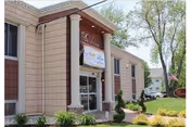 Exterior view of Daleview Care Center entrance with decorative columns and landscaping.