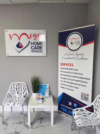 Indoor lobby with MEGA HOME CARE SERVICES sign, banner, and white chairs.