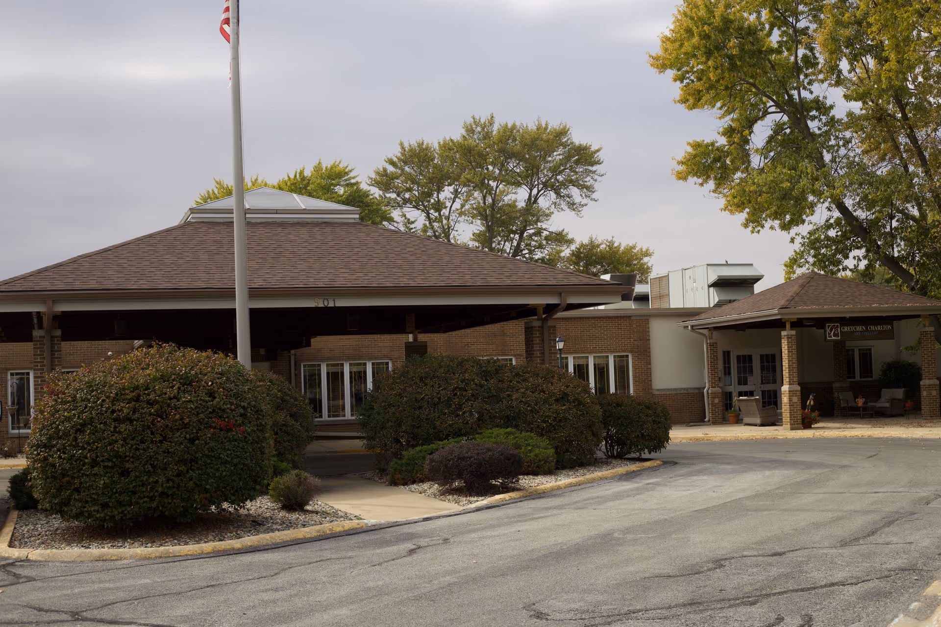 Exterior view of Arc at Kankakee entrance with brick building and landscaping.