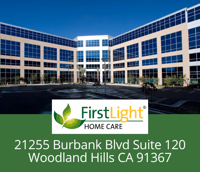 Modern building exterior with large glass windows and FirstLight Home Care logo banner.
