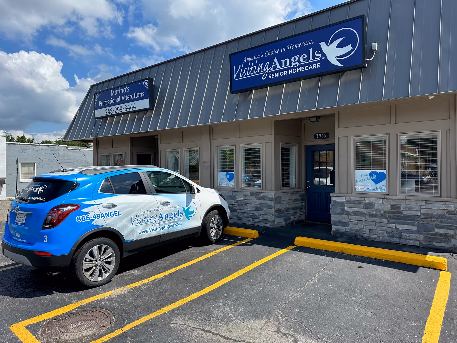 Exterior view of Visiting Angels Senior Homecare building with a blue-and-white parked vehicle.