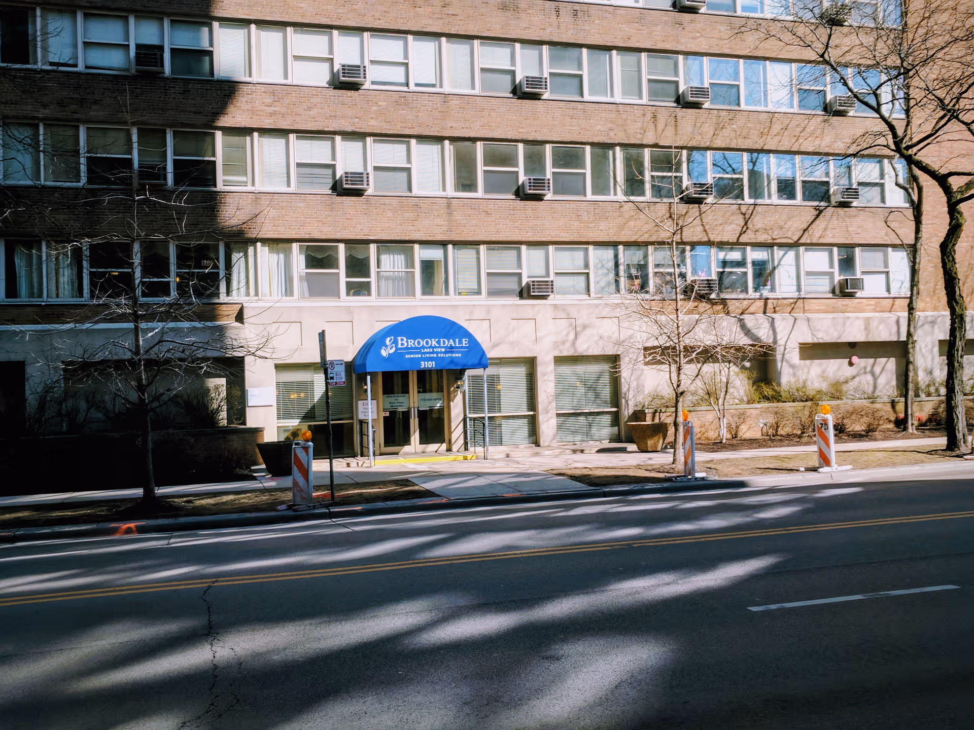 Front of Brookdale Lake View senior living building with blue entrance awning