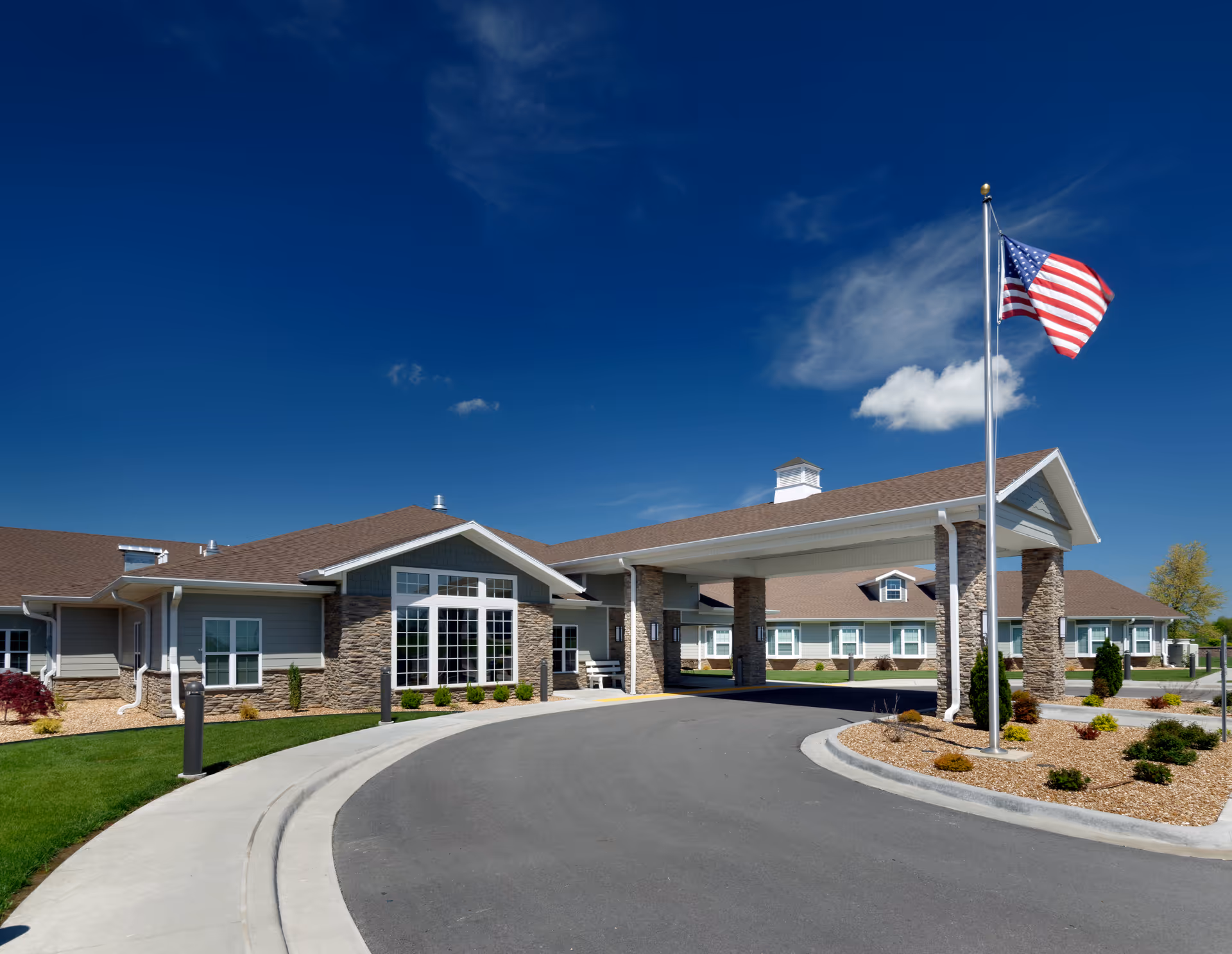 Front exterior of Lake Stockton Healthcare Facility with flagpole and entrance.