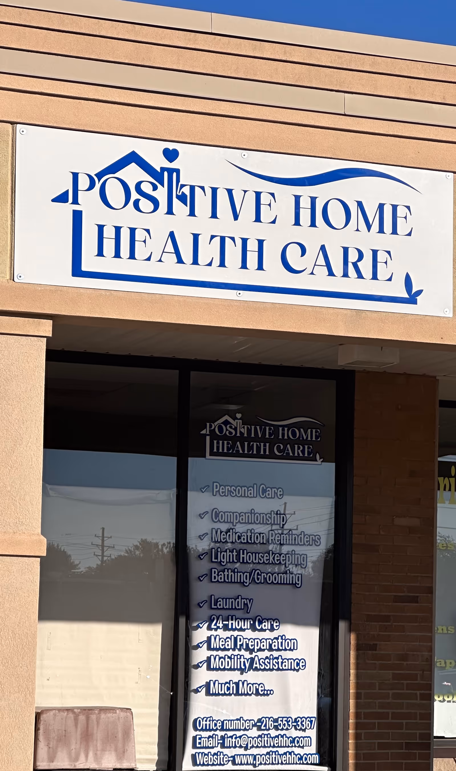 Exterior view of a building front with Positive Home Health Care sign.