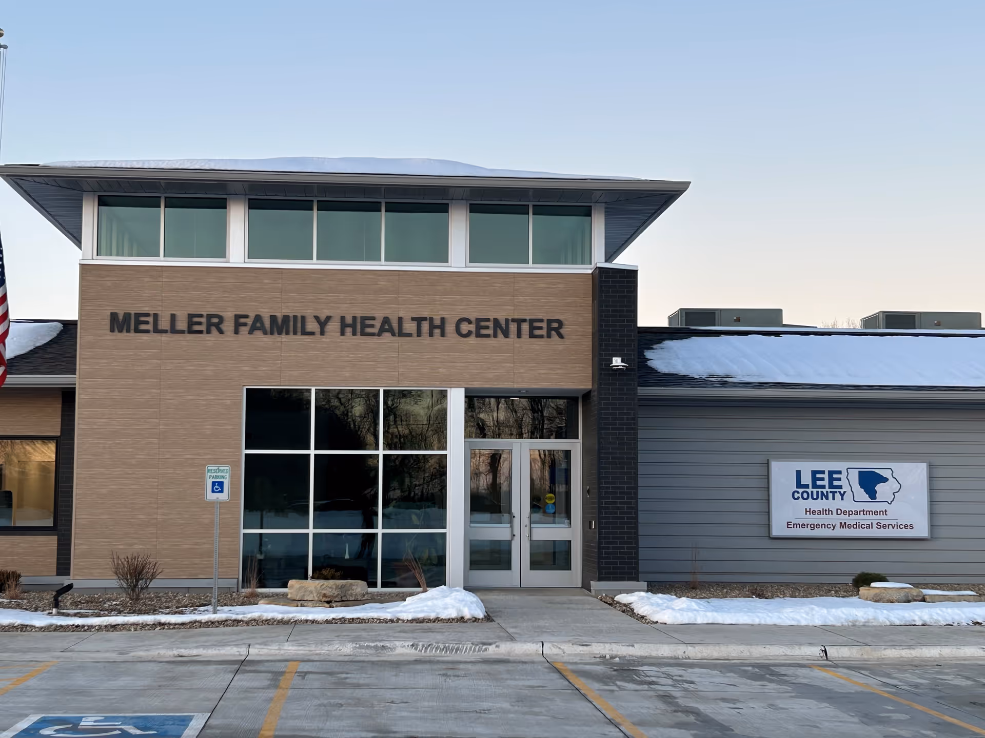 Front view of Meller Family Health Center building with glass entrance.