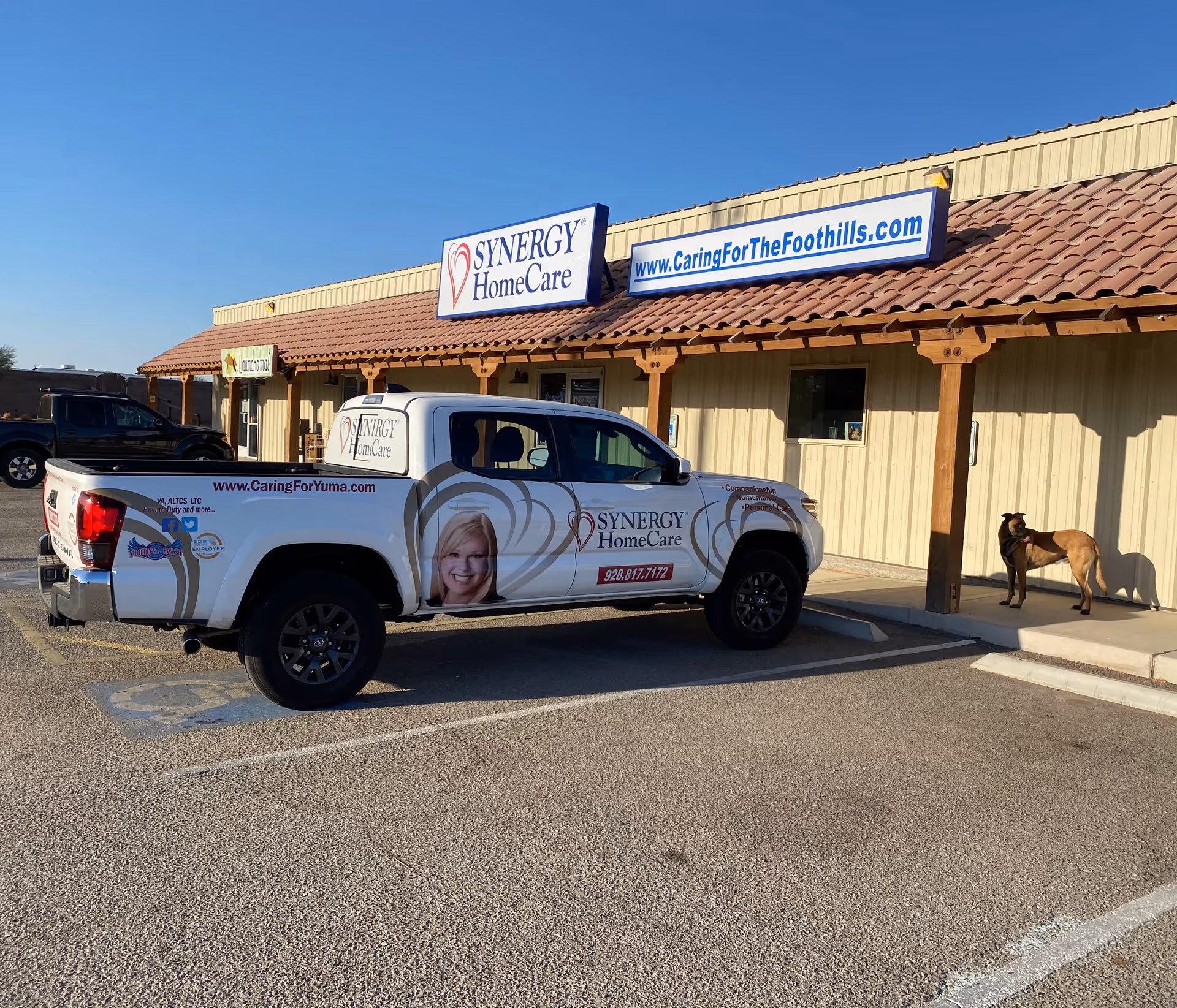 Branded SYNERGY HomeCare truck parked outside Fortuna Foothills facility.