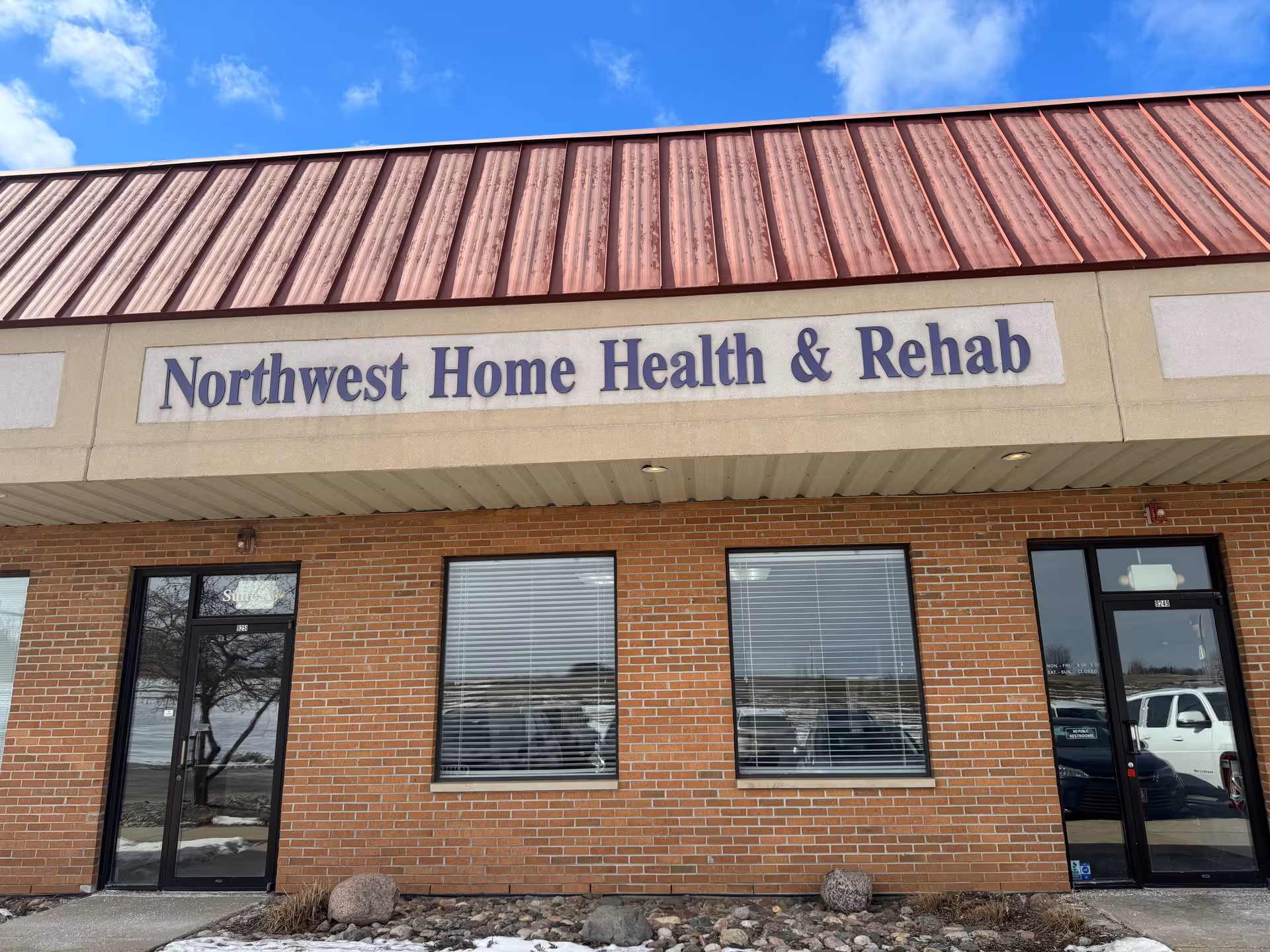 Front view of a brick building with a sign reading Northwest Home Health & Rehab