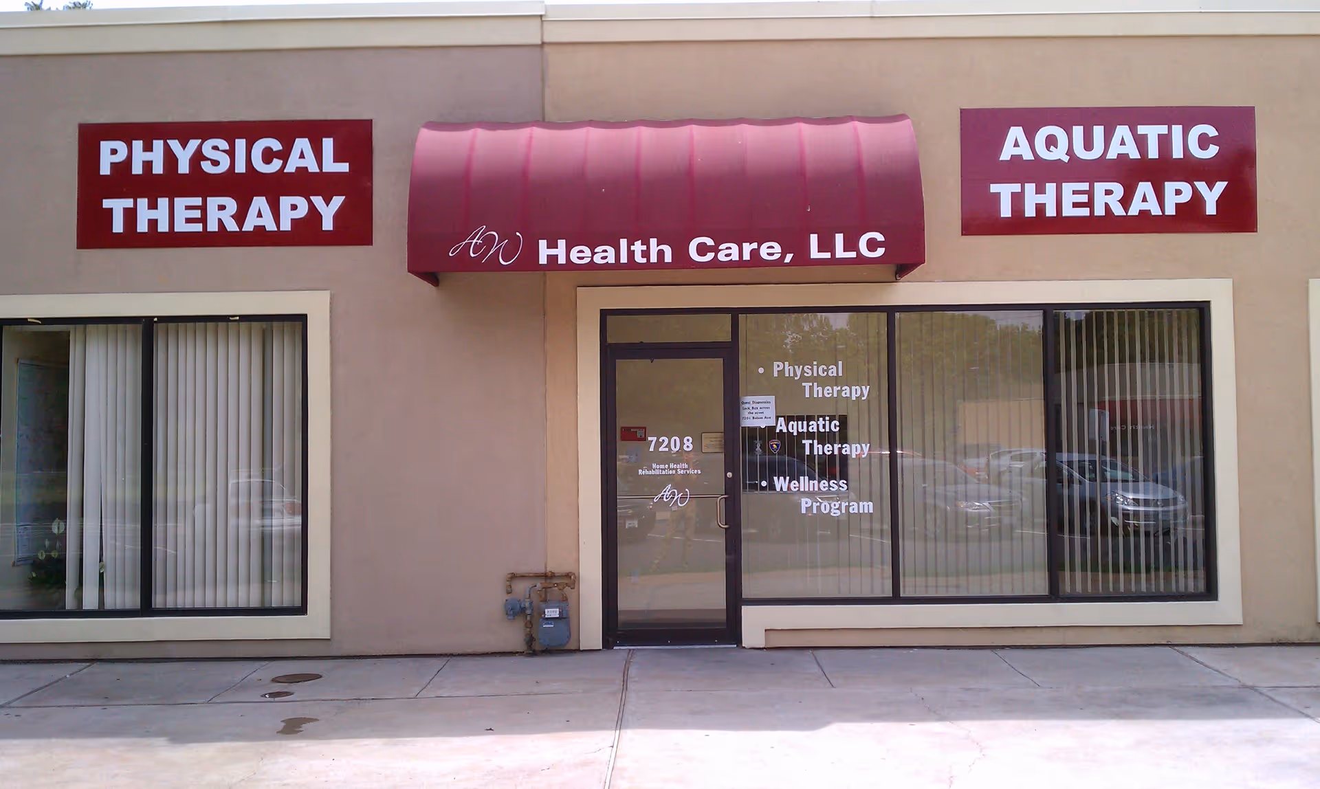 Exterior view of AW Health Care storefront advertising physical and aquatic therapy services.