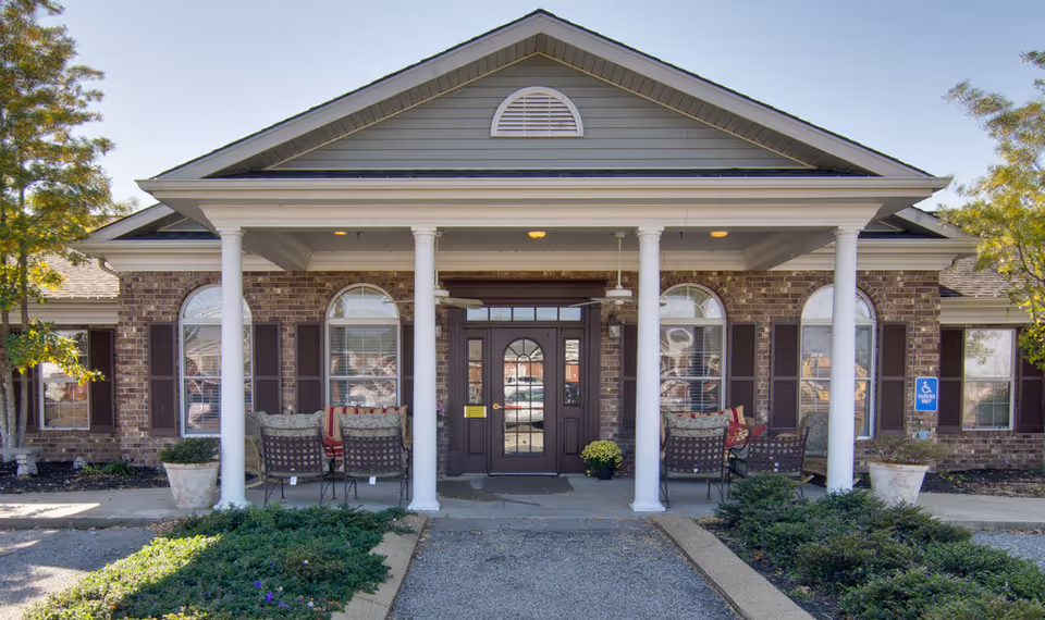 Front view of The Arbors at the Etheridge House with a brick facade and covered entrance.