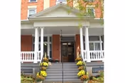 Front view of Faatz-Crofut Home for the Elderly with brick facade and white columns.