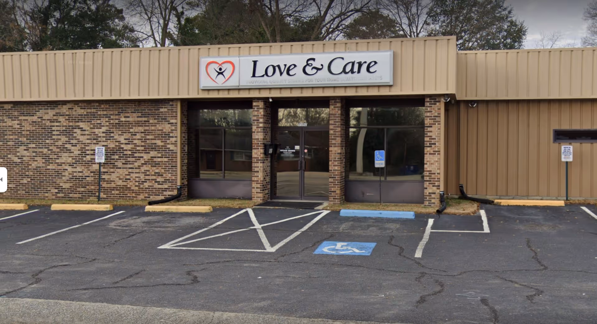 Front view of a Love and Care Home Care Agency building with a parking lot.