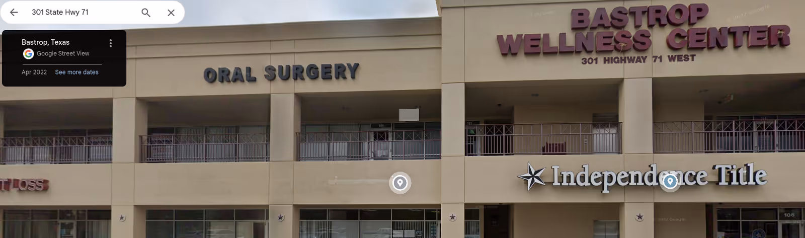 Facade of a multi-tenant medical building with signage for Oral Surgery and Wellness Center.