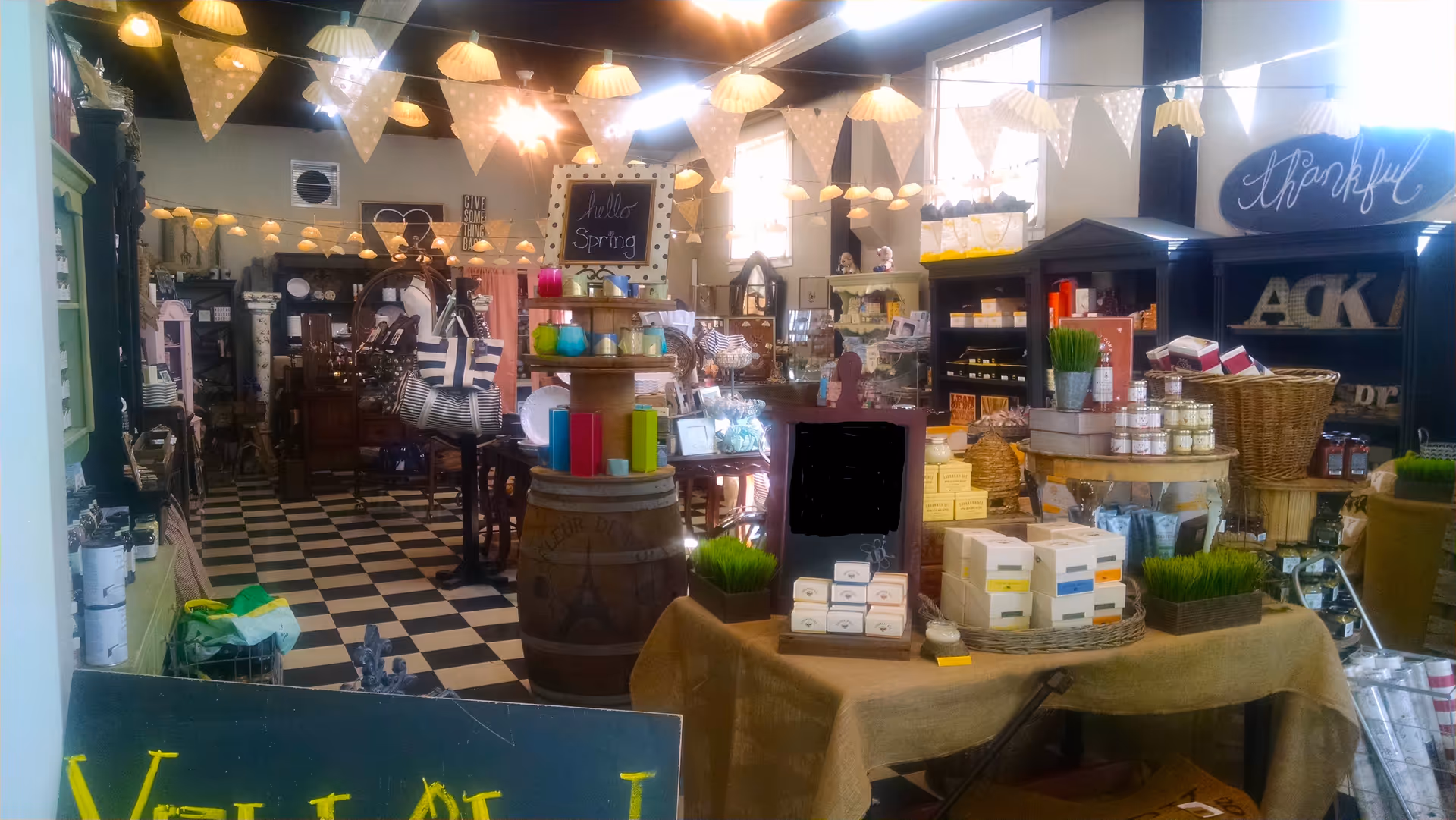 Fleur De Lis gift shop interior with checkered floor and displays.