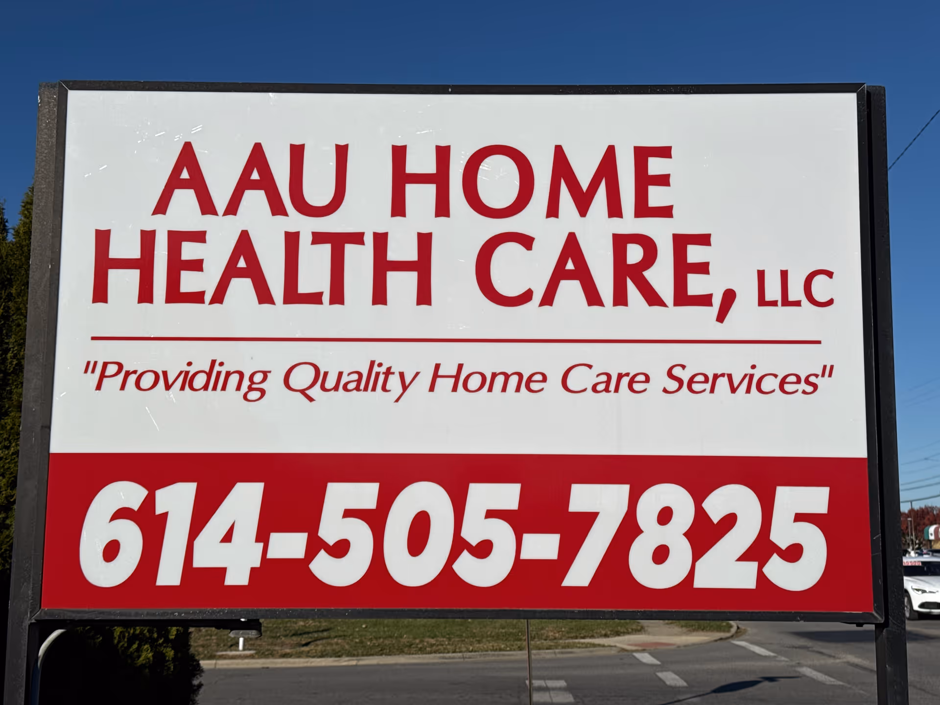 Large outdoor sign for AAU Home Health Care LLC with phone number.