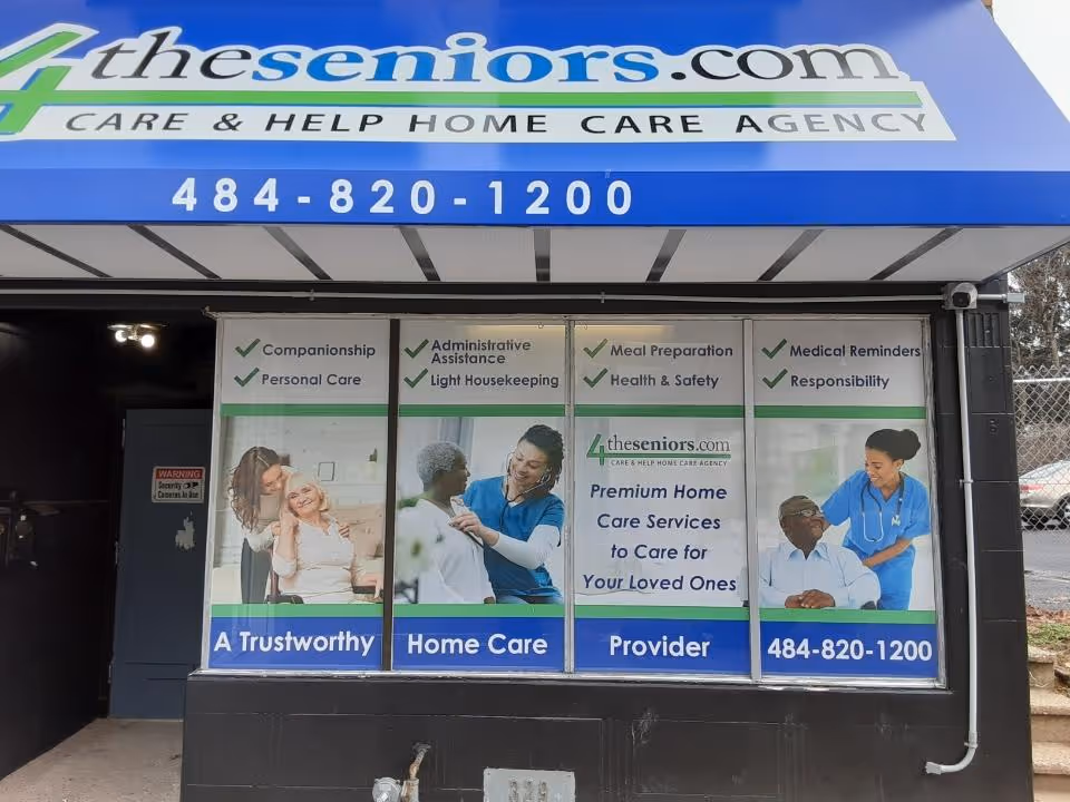 Exterior storefront with blue awning and posters advertising Care & Help Home Care Agency.