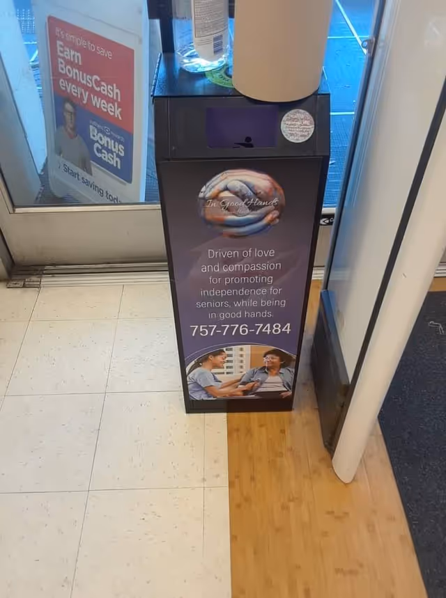 Promotional stand advertising In Good Hands Home Health Care near a doorway.