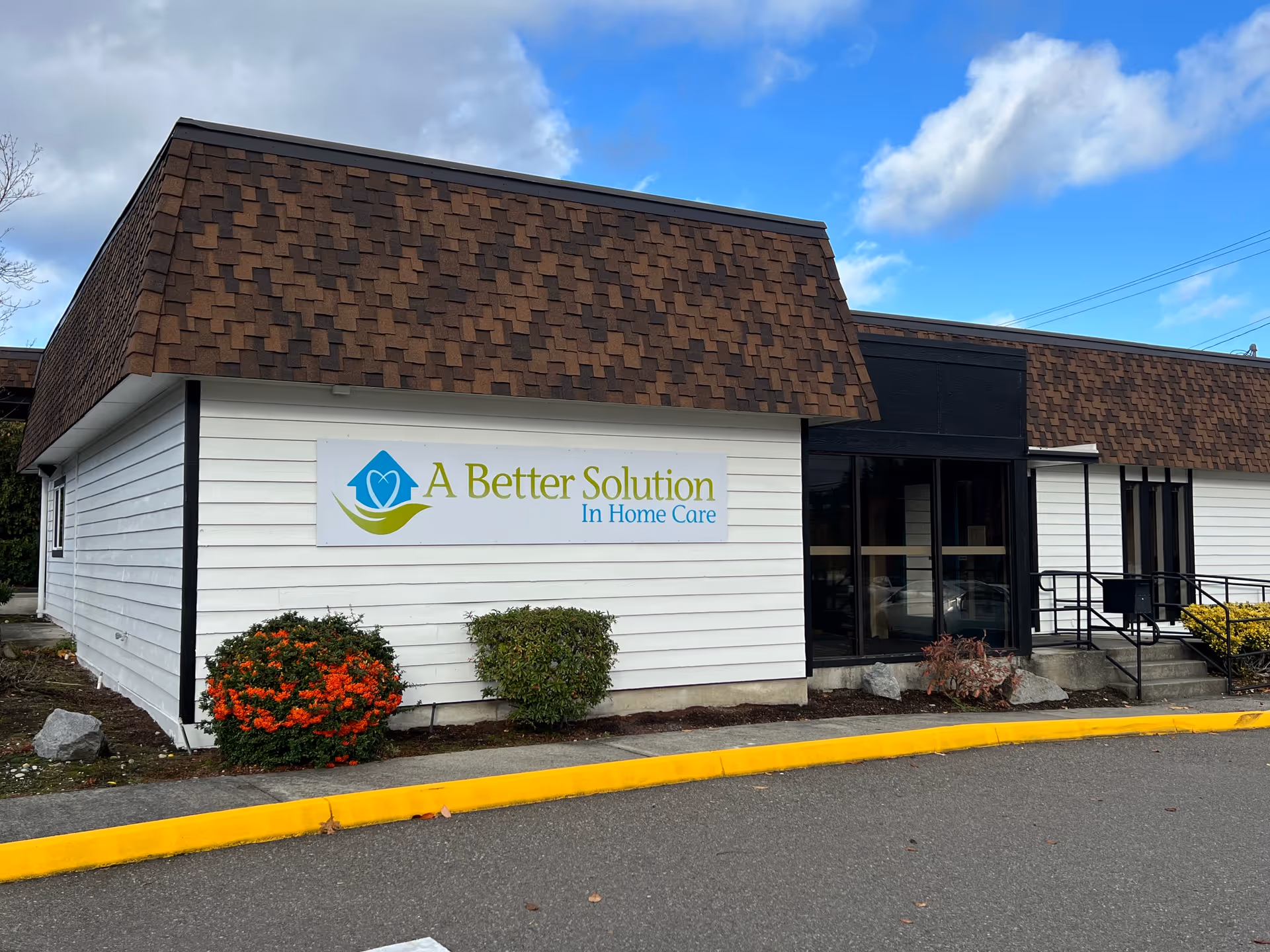 Facade of a senior care facility with sign reading A Better Solution In Home Care.