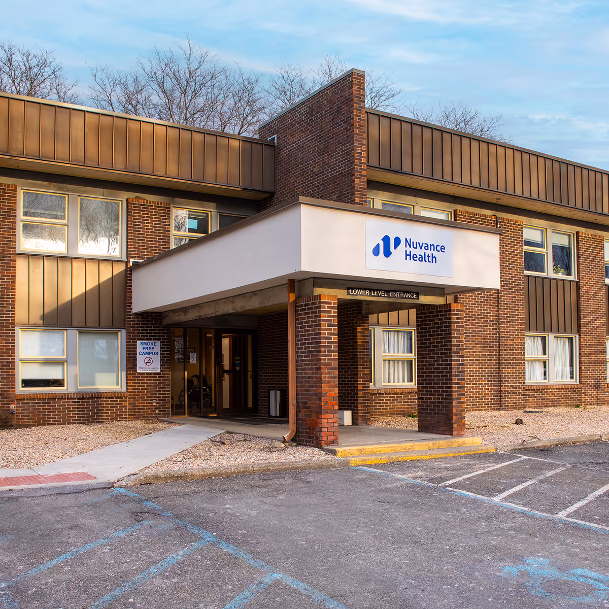 Brick medical building with Nuvance Health sign and a covered entrance.