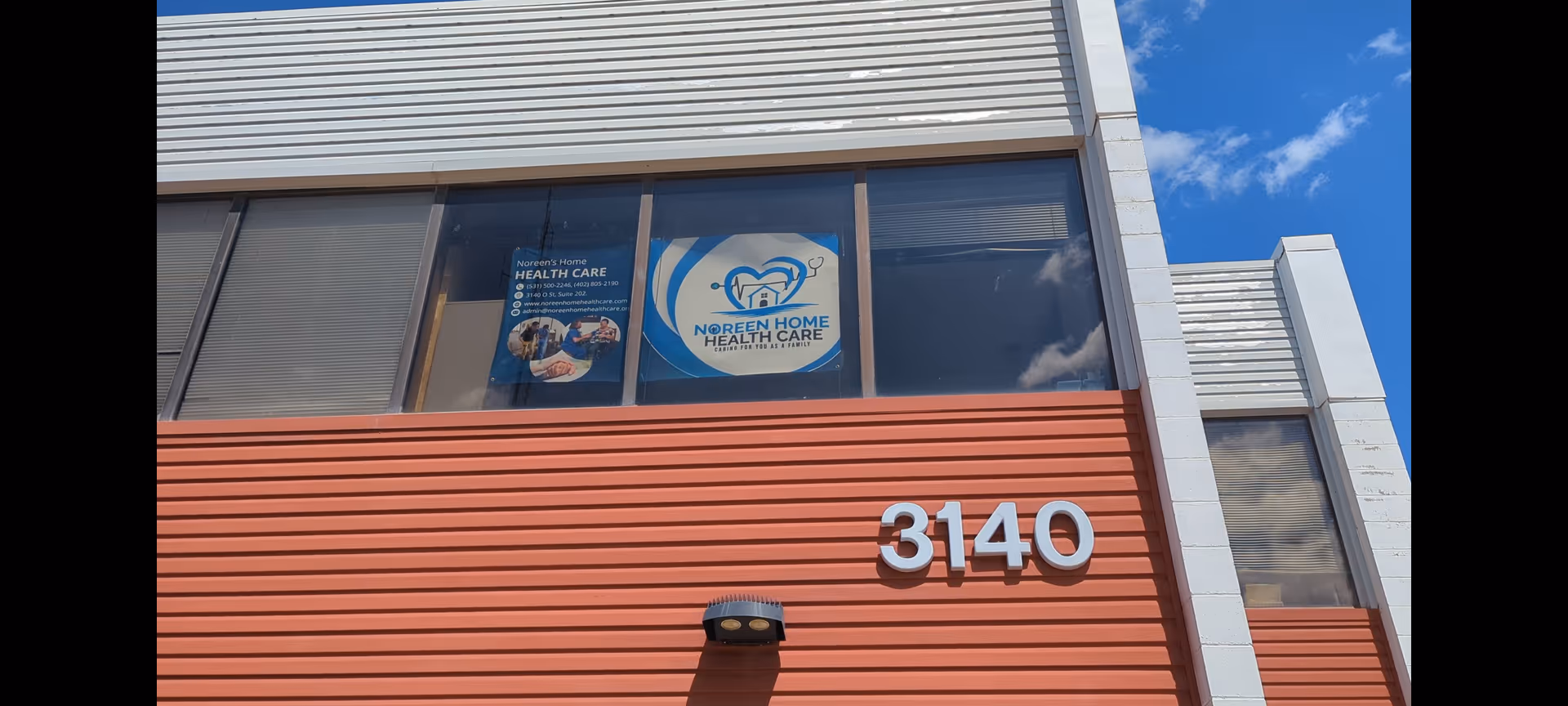 Exterior view of Noreen Home Care building with orange facade and address 3140.