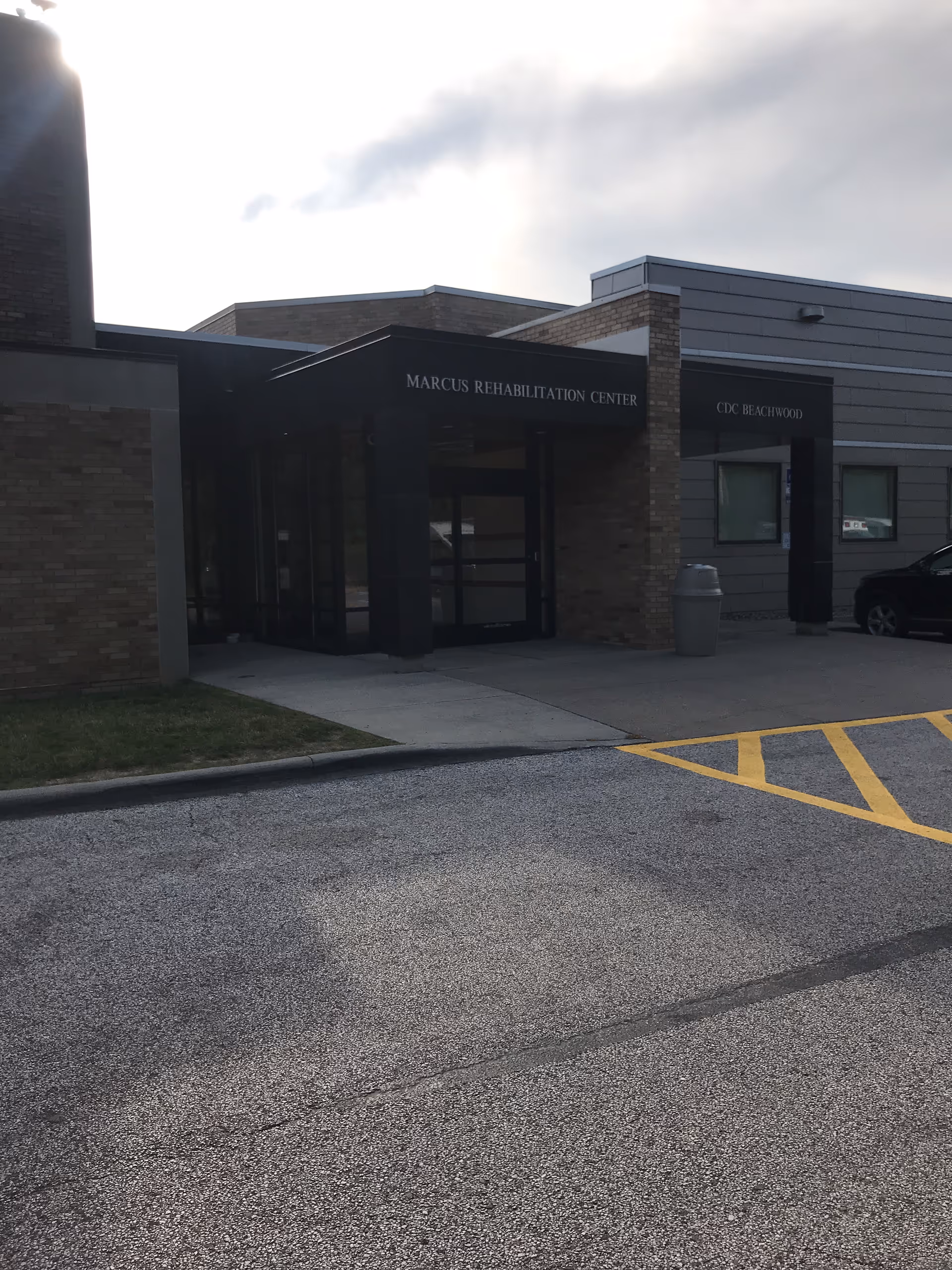 Front entrance of Menorah Park Marcus Post Rehab Center with brick exterior.