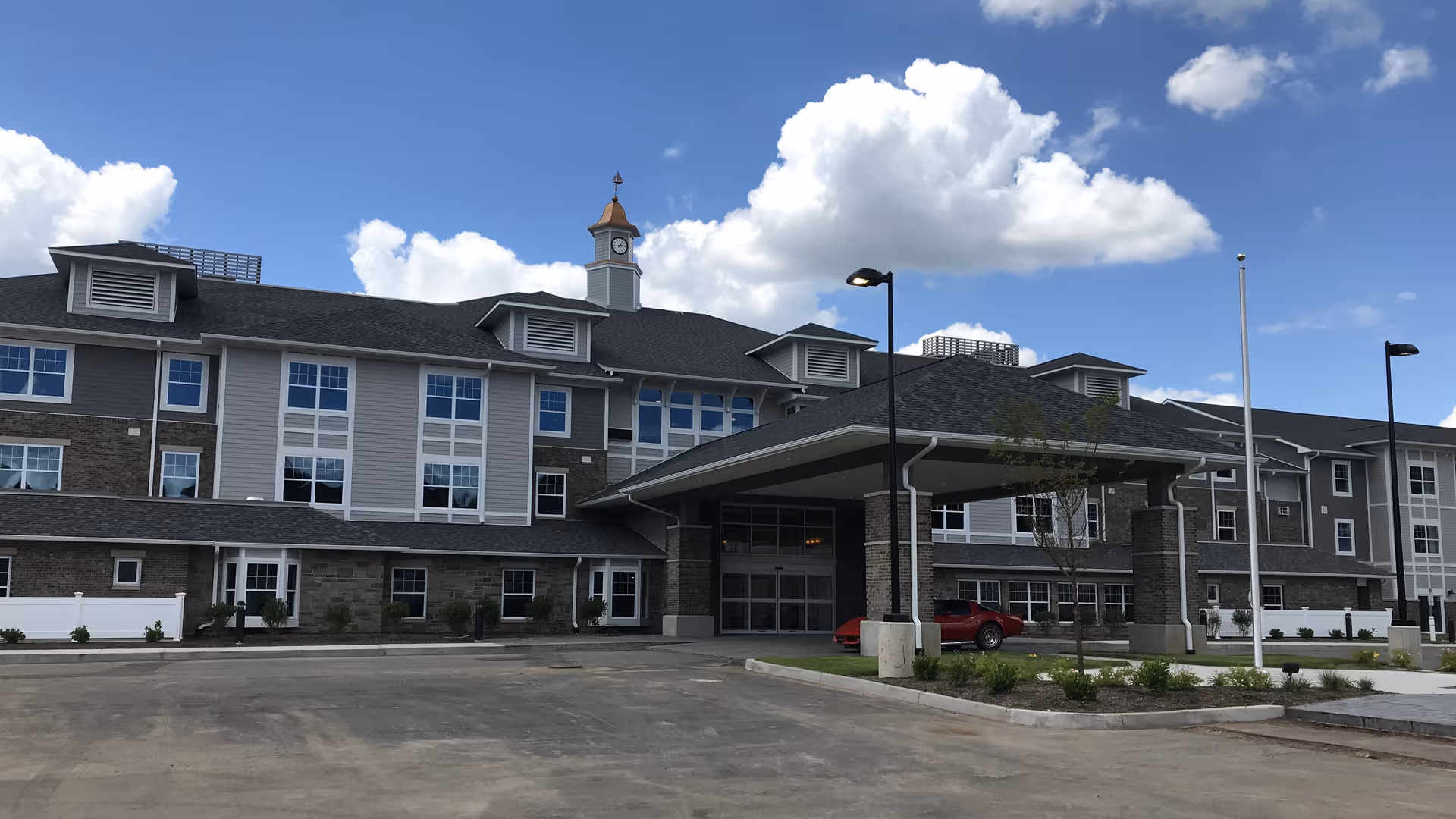 Exterior view of Evergreen Crossings Retirement Community featuring a covered entrance
